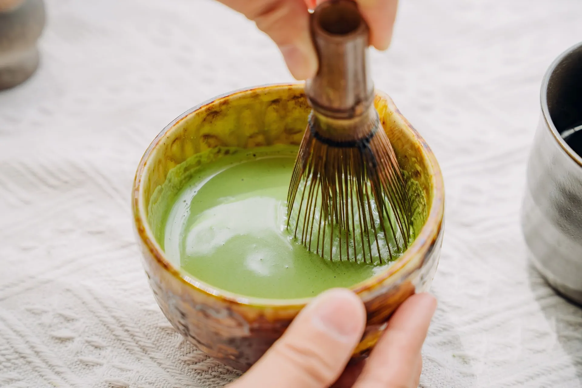 whisking matcha